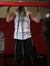 A high-quality image showcasing an individual performing a squat with resistance bands